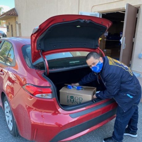 Man getting box out of trunk