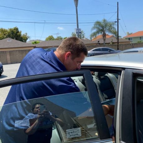 Man next to open car door